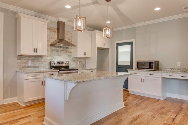 11B Double Br, Columbia, TN 38401 - kitchen with appliances with stainless steel finishes, wall chimney exhaust hood, ornamental molding, light wood finished floors, and tasteful backsplash