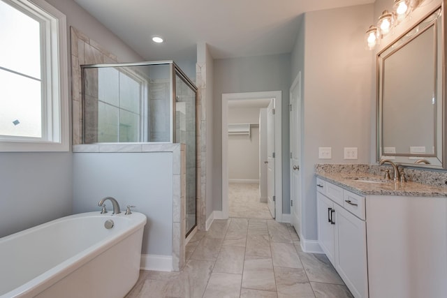 11B Double Br, Columbia, TN 38401 - full bath with a stall shower, vanity, a freestanding bath, marble look tile flooring, and a walk in closet