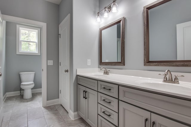 11B Double Br, Columbia, TN 38401 - full bathroom with double vanity, marble finish flooring, toilet, and baseboards