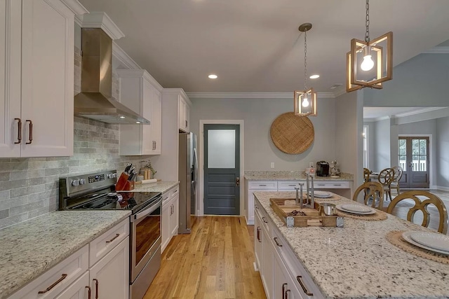 11B Double Br, Columbia, TN 38401 - kitchen with wall chimney range hood, appliances with stainless steel finishes, white cabinets, tasteful backsplash, and ornamental molding