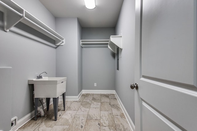 11B Double Br, Columbia, TN 38401 - washroom with a sink, baseboards, and light marble finish flooring