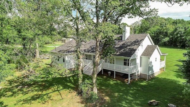 11B Double Br, Columbia, TN 38401 - rear view of house with a porch, a lawn, a chimney, roof with shingles, and stairs