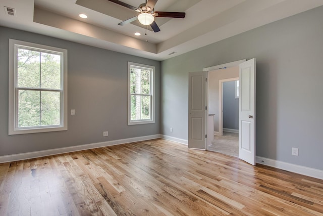 11B Double Br, Columbia, TN 38401 - spare room with a tray ceiling, ceiling fan, plenty of natural light, light wood-style flooring, and recessed lighting