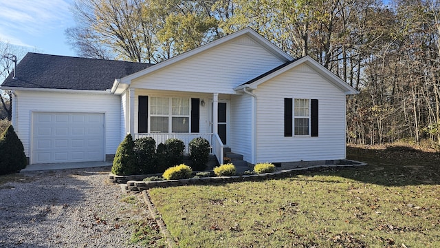 ranch-style home with a garage and a front lawn