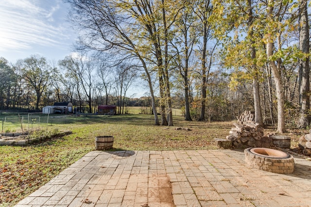 view of patio with a fire pit