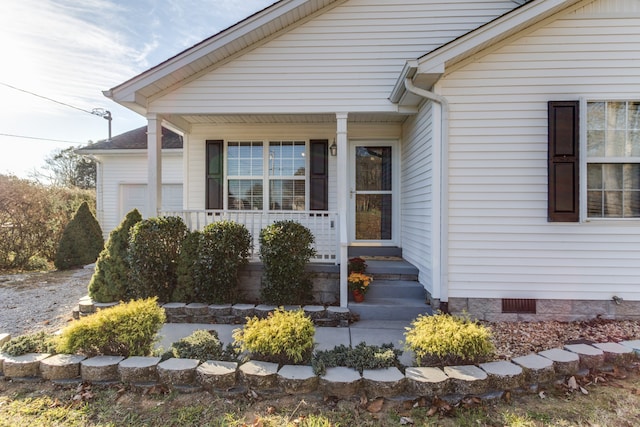 doorway to property with covered porch