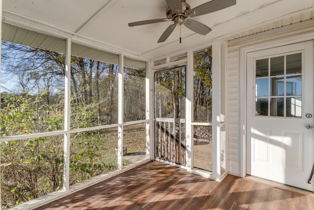 unfurnished sunroom with plenty of natural light and ceiling fan