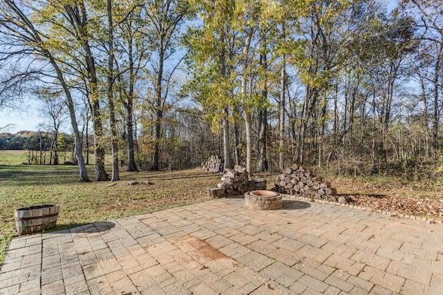 view of patio / terrace with an outdoor fire pit