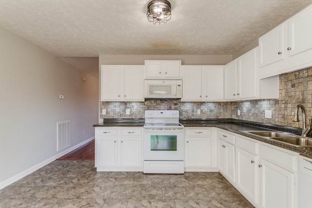 kitchen featuring white cabinets, white appliances, backsplash, and sink