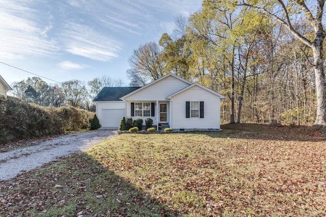 single story home with a front yard and a garage