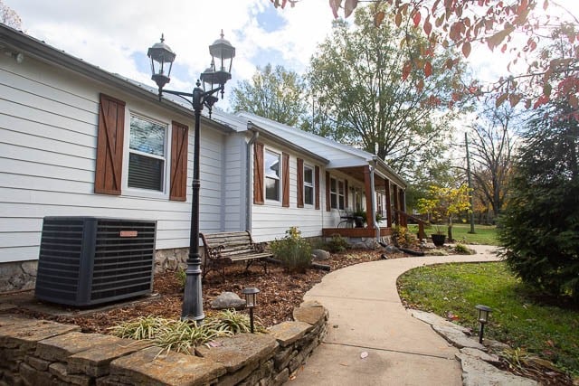 view of property exterior featuring central air condition unit