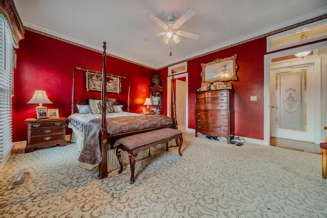 carpeted bedroom featuring ceiling fan and ornamental molding