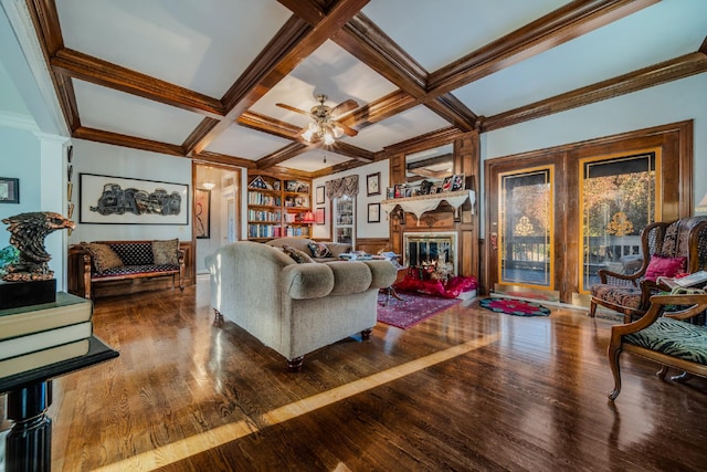 living room with hardwood / wood-style floors, ceiling fan, and coffered ceiling