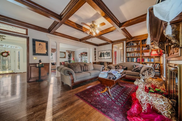 living room featuring dark hardwood / wood-style flooring, beamed ceiling, and coffered ceiling