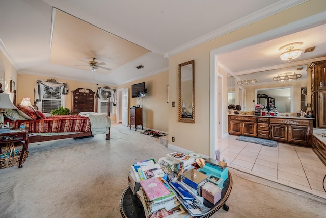 carpeted bedroom featuring ceiling fan and crown molding