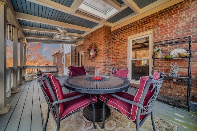 deck at dusk with ceiling fan