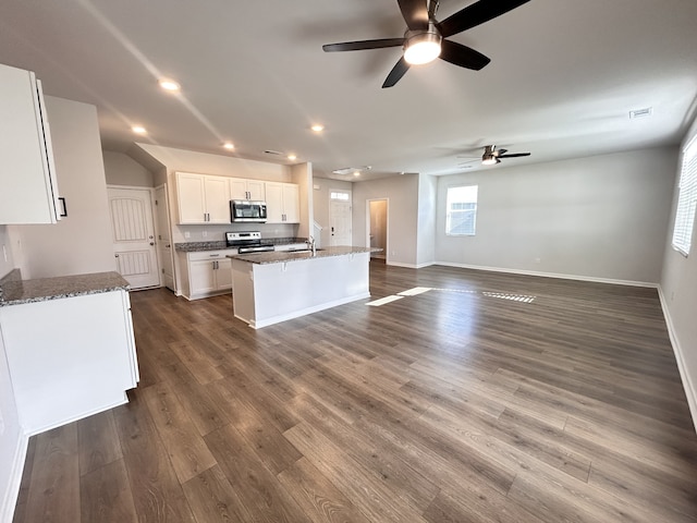 kitchen featuring white cabinetry, a center island with sink, dark hardwood / wood-style floors, and appliances with stainless steel finishes