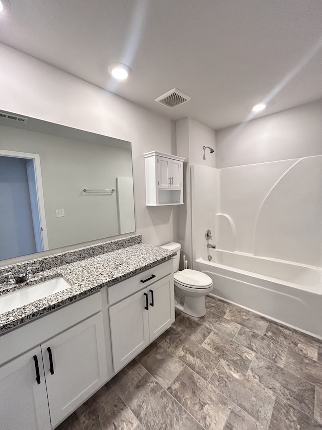 full bathroom with vanity, toilet, and shower / washtub combination