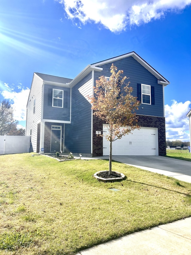 view of front of home with a front lawn and a garage