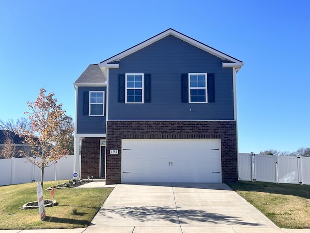 view of front of house with a garage and a front yard