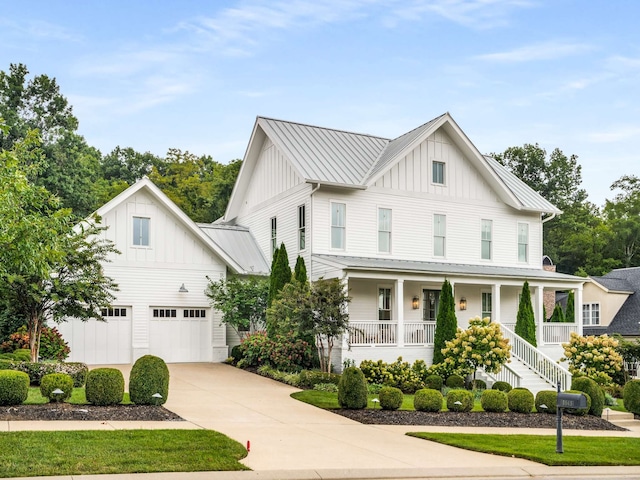 modern farmhouse style home featuring a porch and a garage