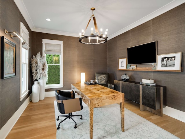 office with ornamental molding, light hardwood / wood-style flooring, and an inviting chandelier