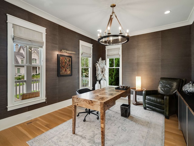 office featuring an inviting chandelier, light hardwood / wood-style flooring, and crown molding