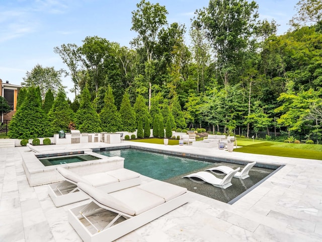 view of swimming pool with a patio area, an in ground hot tub, and a yard