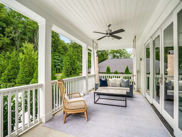 view of patio with ceiling fan, french doors, and covered porch