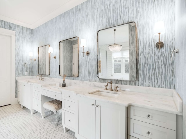 bathroom with crown molding and vanity