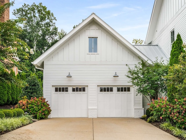 view of side of property with a garage