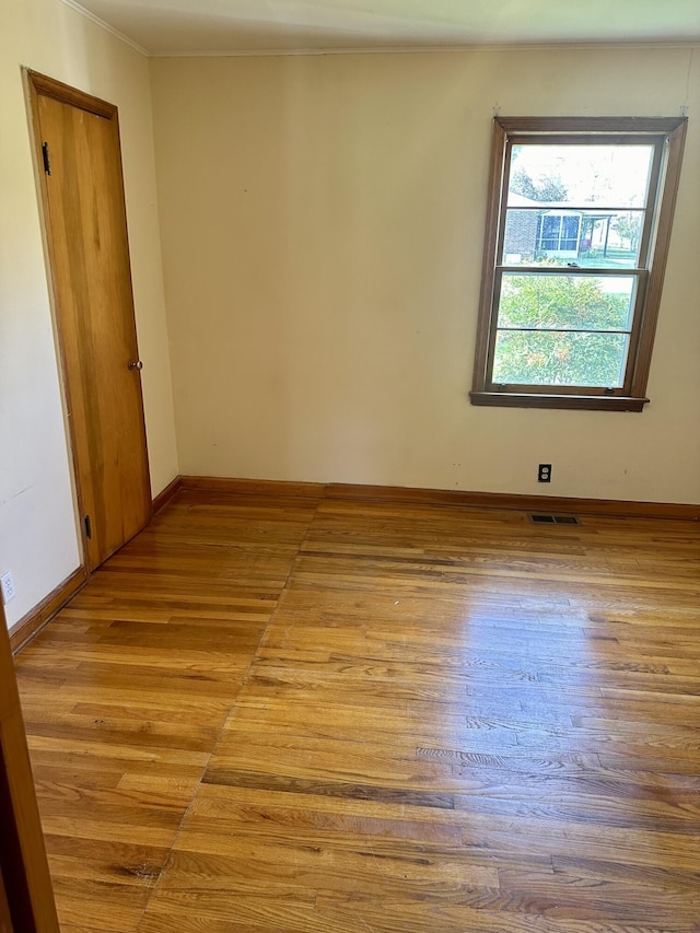 unfurnished room with light hardwood / wood-style flooring