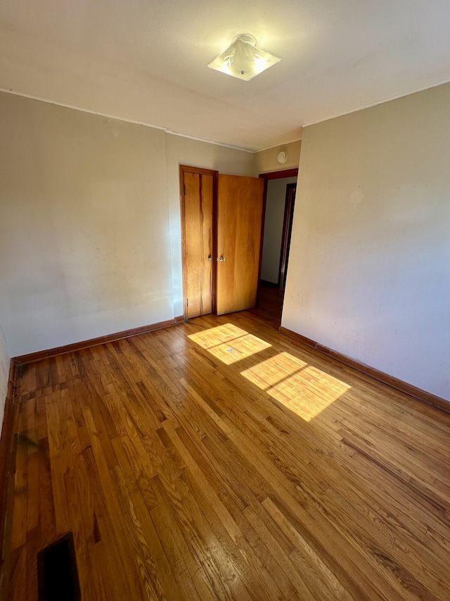 spare room featuring light hardwood / wood-style floors