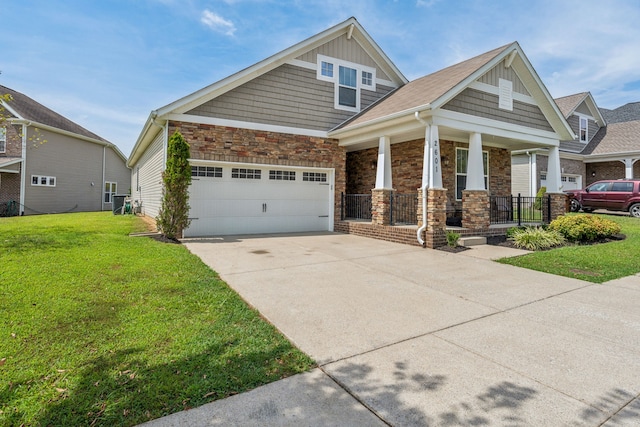 craftsman-style house featuring a front lawn, a porch, and a garage