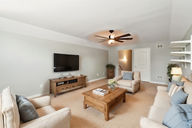 living room with ceiling fan and light carpet