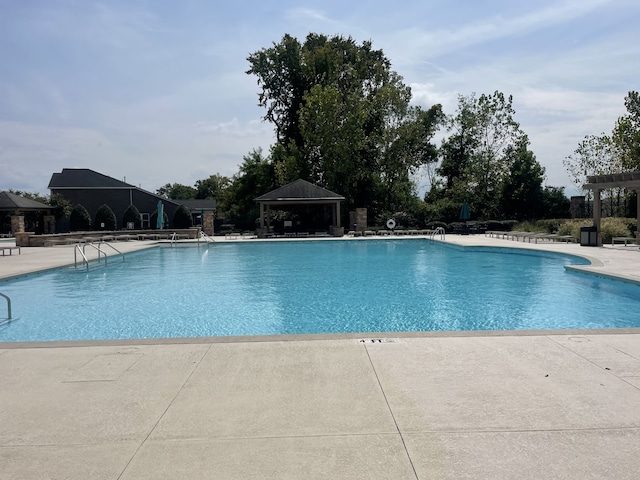 view of pool featuring a gazebo and a patio