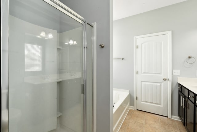 bathroom with vanity and independent shower and bath