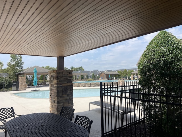 view of swimming pool with a gazebo and a patio