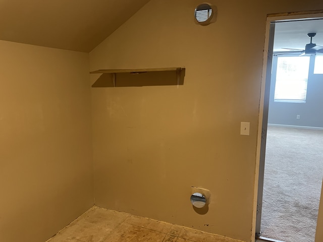 laundry area featuring ceiling fan and carpet floors