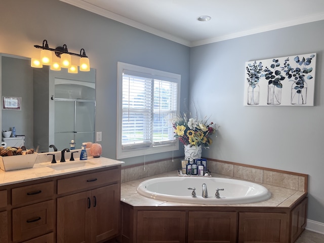 bathroom with ornamental molding, vanity, and independent shower and bath