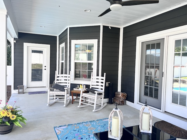 view of patio / terrace with ceiling fan and a porch