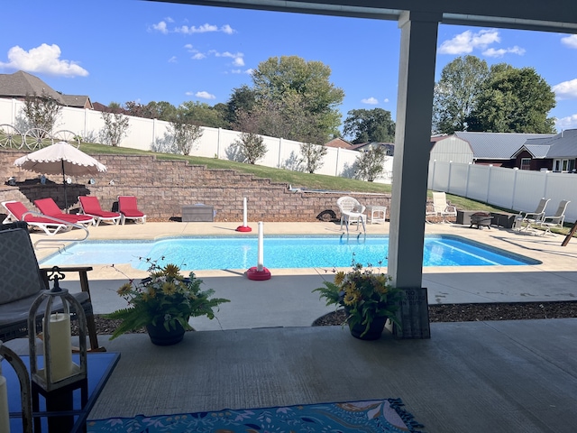 view of pool with a patio