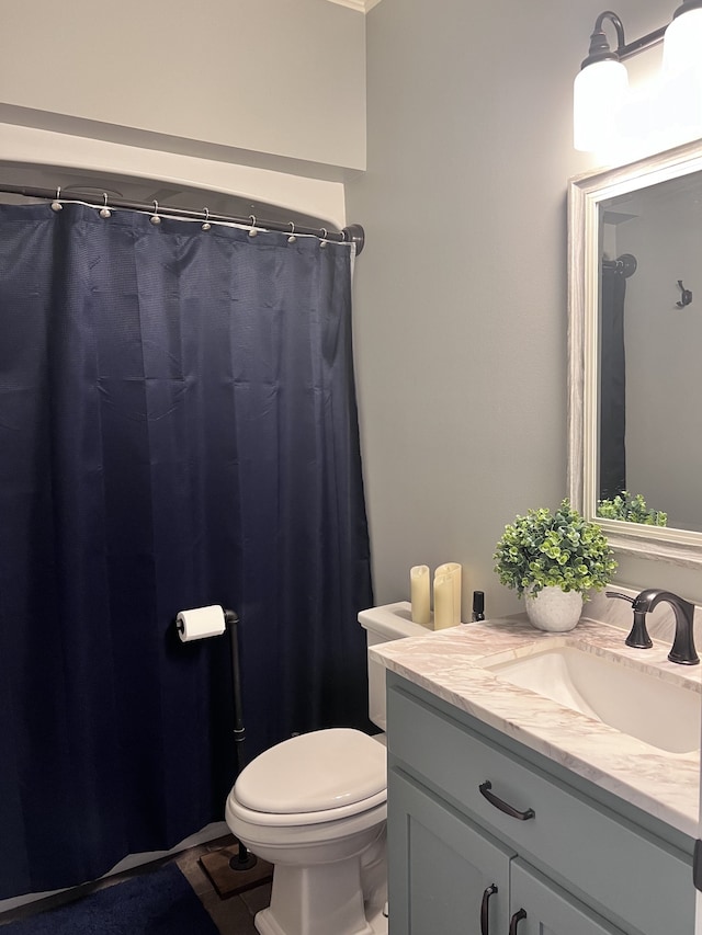 bathroom with vanity and toilet