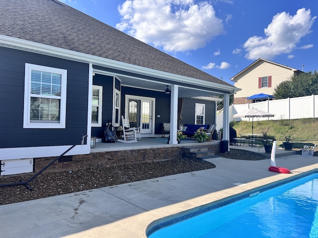 view of swimming pool featuring a patio area