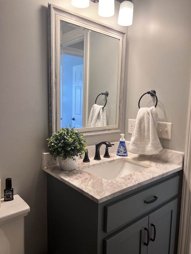 bathroom with vanity and toilet