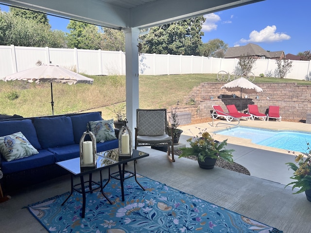 view of patio featuring a fenced in pool and an outdoor living space