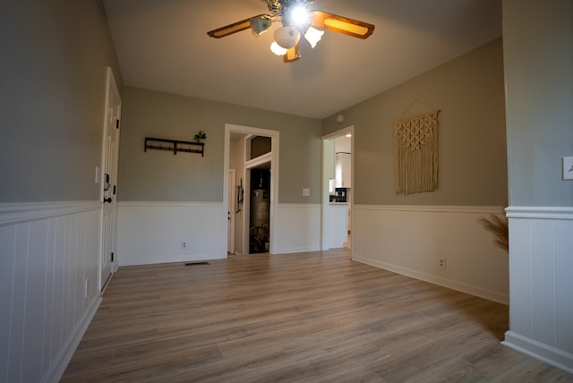 unfurnished room with light hardwood / wood-style floors and ceiling fan