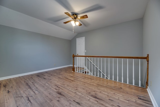 bonus room featuring ceiling fan, light hardwood / wood-style floors, and lofted ceiling