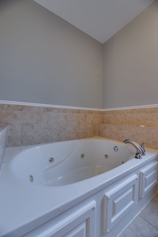 bathroom featuring a bathing tub and tile patterned flooring