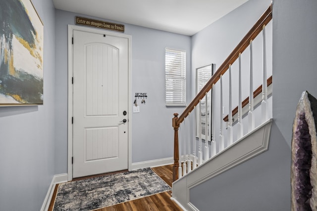 entryway with hardwood / wood-style flooring